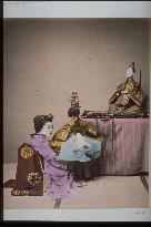 Woman displaying ohina-sama dolls