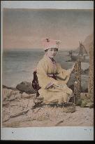 Woman collecting sea shells