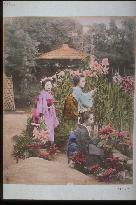 Girls picking flowers in the garden