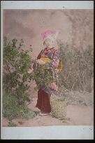Woman collecting wild vegetables