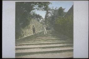 Foreign men descending stone steps