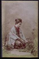 A woman arranging flowers