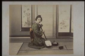 A woman with a shamisen