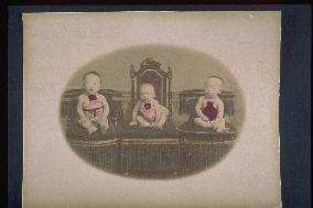 Three children wearing aprons