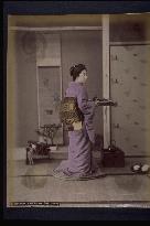 A woman preparing dishes for guests