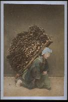 A woman carrying firewood
