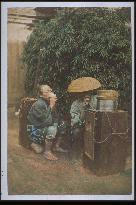 A vendor selling amazake (a sweet beverage)