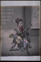 A girl playing the shamisen