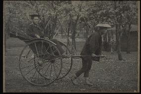 A jinrikisha carrying a foreign sailor