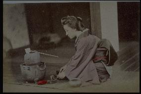 A woman making tea