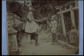 A passenger on a horse and the driver