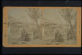 A samurai warrior drawing water from a well