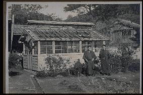 A greenhouse and men