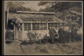 A greenhouse and men