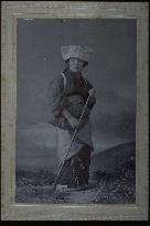 A woman holding a broom