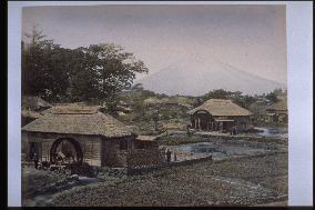 A water mill in Mishima and Mt. Fuji