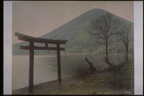 The torii of Chugu Shrine by Lake Chuzenji,and Mt. Nantai