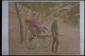 A woman on a jinrikisha