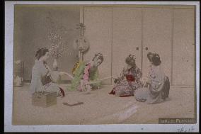 Four women playing with a rope (a hanging fox)