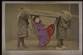 A girl in a basket palanquin