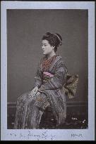 Portrait of a woman sitting in a chair