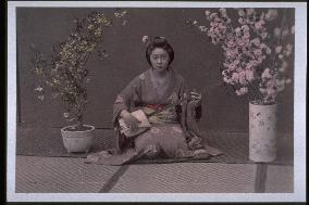 A geiko playing the shamisen