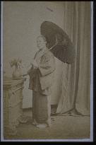 An old woman holding an umbrella (GWYN COLLER Photo Studio)