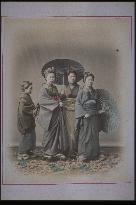 Women holding umbrellas