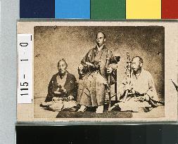 Samurai Sitting on Chair with Two Attendants