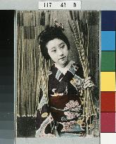 Woman Peeking through a Bamboo Curtain