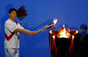 Downscaled Tokyo Olympic torch relay