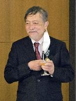 Award-winning writer Ikezawa receives French honor