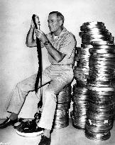 HENRY FONDA LOOKING AT 35MM FILM  FILM HANDLING FILM CANS