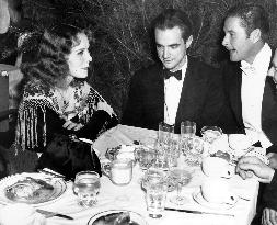 HELEN GILBERT, HOWARD HUGHES AND ERROL FLYNN AT THE ANNUAL M