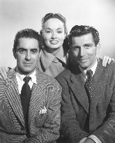 Tyrone Power (left) Ann Blyth  Michael Rennie in THE HOUSE I