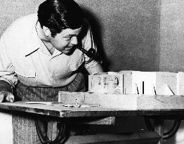 ORSON WELLES CHECKING THE SET MODELS FOR THE MAGNIFICENT AMB