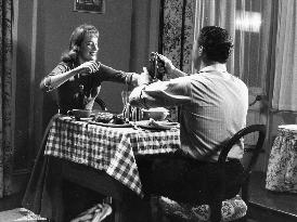 WOMAN IN A DRESSING GOWN