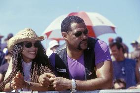 Queenie (LISA BONET) and Smoke (LAURENCE FISHBURNE) watch a