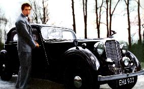 Actor NORMAN WOOLAND and his 14 horsepower Rover saloon car