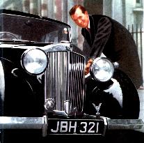 Actor MICHAEL DENISON with his Triumph 14 horsepower saloon