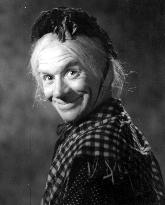 ARTHUR LUCAN in costume as OLD MOTHER RILEY, a garrulous Iri