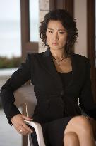 GONG LI as Chinese-Cuban financial criminal Isabella in &amp;quo