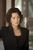 GONG LI as Chinese-Cuban financial criminal Isabella in &amp;quo