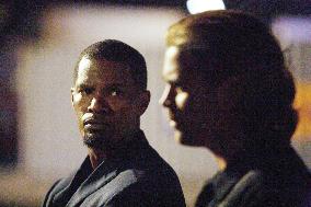 JAMIE FOXX as Detective Ricardo Tubbs and COLIN FARRELL as D