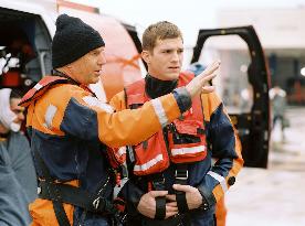 A famed Coast Guard Rescue swimmer (KEVIN COSTNER) is re-ass
