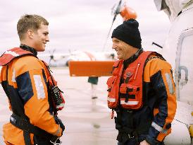 A famed Coast Guard Rescue swimmer (KEVIN COSTNER, right) is