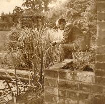 FILM DIRECTOR ROBERT STEVENSON IN THE GARDEN OF PRIORS FARM,