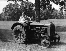 BASIL RADFORD and NAUNTON WAYNE with a tractor