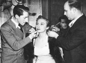 Actress GOOGIE WITHERS getting tjhe attention of the make-up