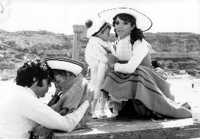 JOAN COLLINS and her husband ANTHONY NEWLEY with their child
